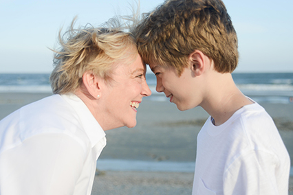 School consultant and Conscious Discipline coach Jessica Shields Flowers with a grade school boy on the beach